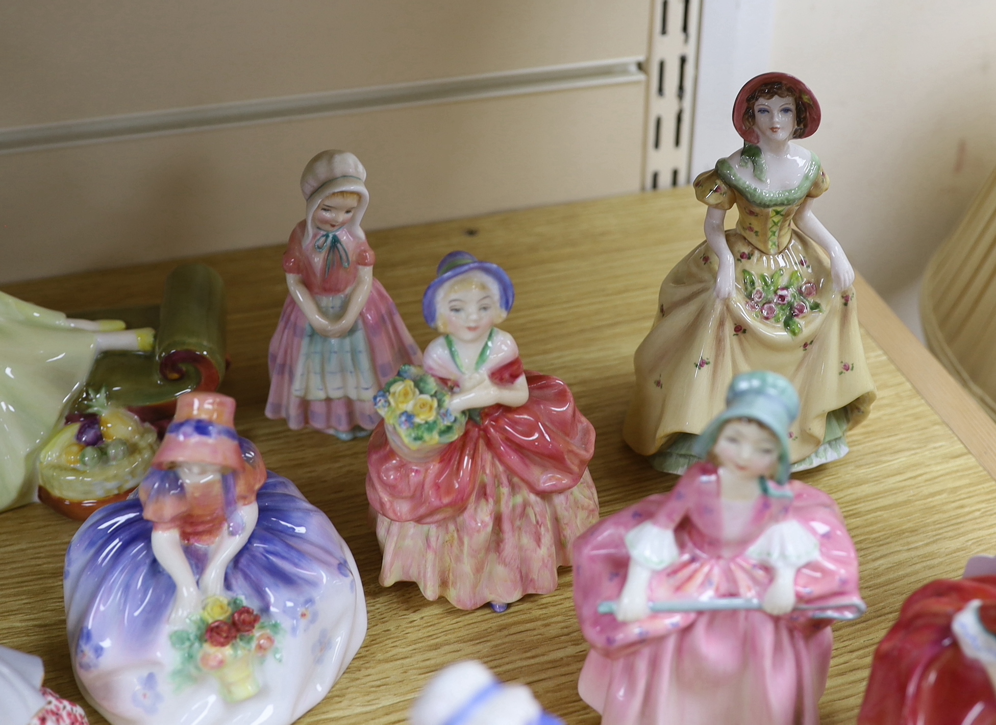 A mixed group of Royal Doulton and Coalport figures and a German figurine, the largest 20cm high